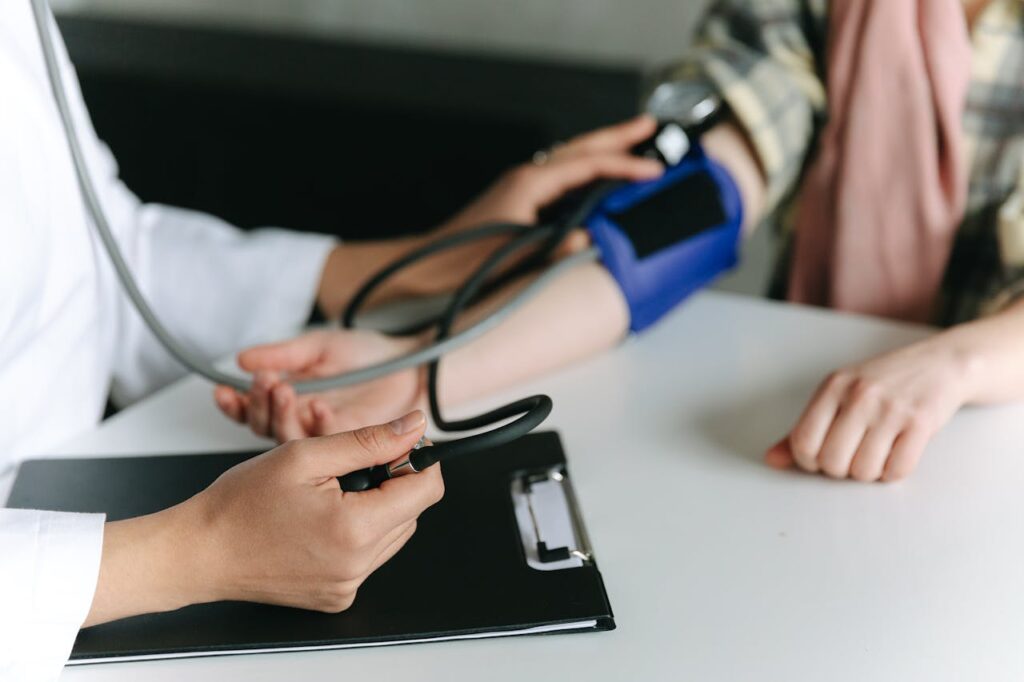 pexels-photo-7659564-1 A Healthcare Worker Measuring a Patient's Blood Pressure Using a Sphygmomanometer